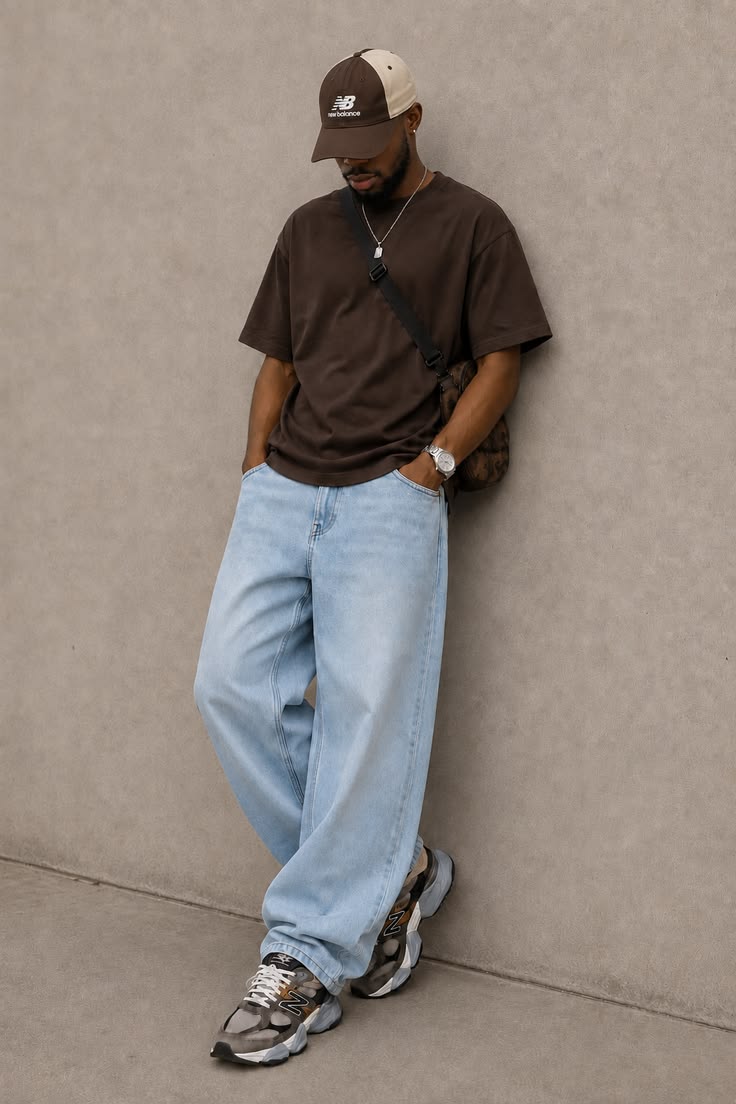 Streetwear look featuring an oversized brown tee and wide-leg denim
